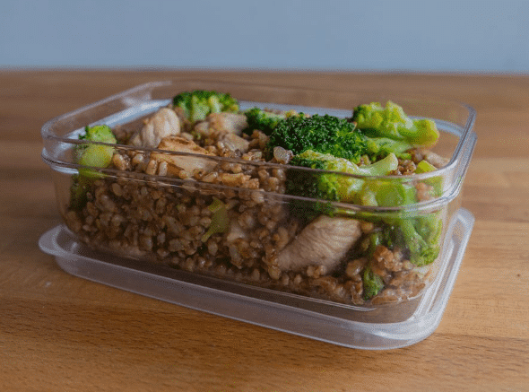 Meal prep of chicken breast, brown rice, potatoes, sweet potatoes and vegetables