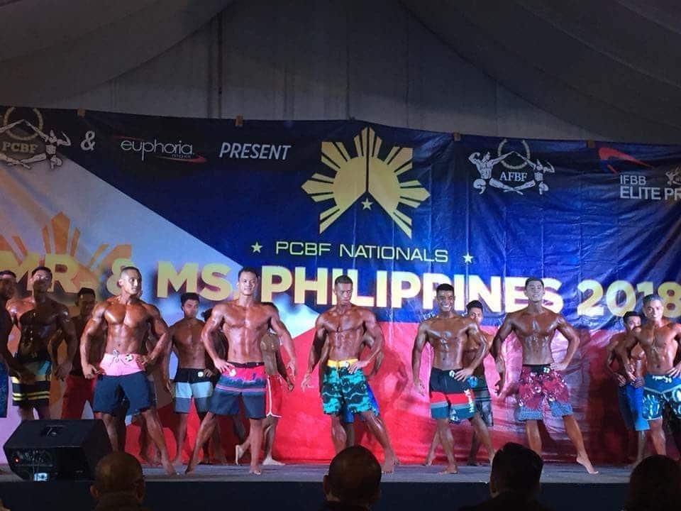Coach Jeff Alagar on stage in the men's physique lineup at PCBF Mr. Philippines 2018